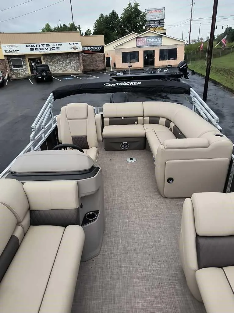 Slide: The Image of 2024 Sun Tracker Party Barge 20 DLX pontoon boat with spacious seating and modern design. - 2