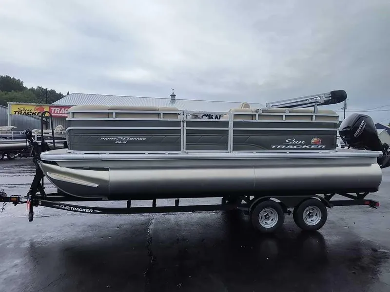 Slide: The Image of 2024 Sun Tracker Party Barge 20 DLX pontoon boat on trailer. - 4