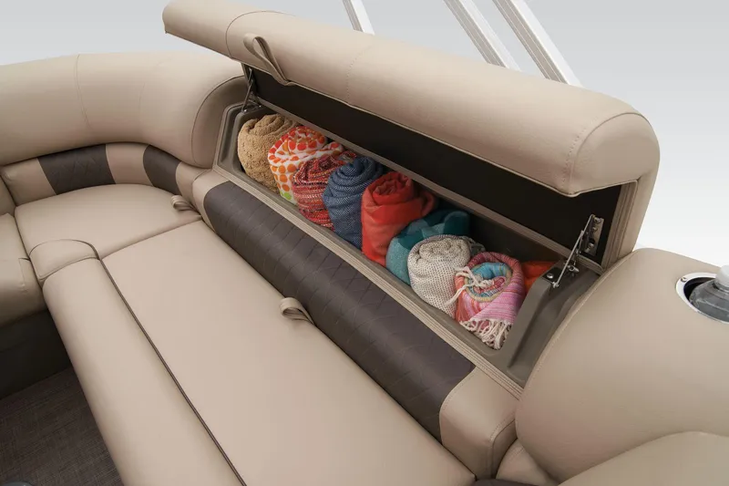 Slide: The Image of 2024 Sun Tracker Party Barge 20 DLX storage compartment with rolled towels. - 46