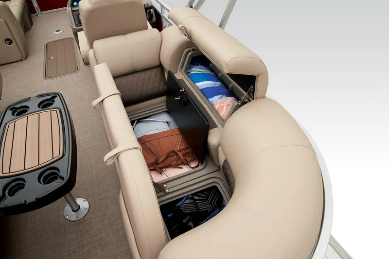 Slide: The Image of 2024 Sun Tracker Party Barge 22 XP3 interior storage compartments with beige seating. - 41