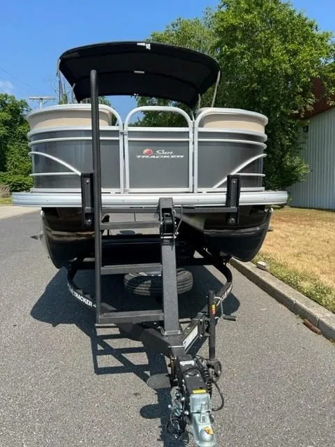 Slide: The Image of 2024 Sun Tracker Party Barge 22 XP3 pontoon boat on a trailer. - 2
