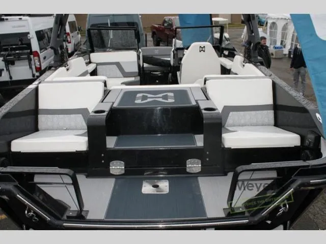 Slide: The Image of 2024 Heyday H20 boat interior with white and gray seating. - 13