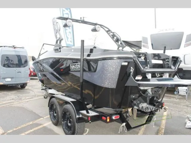 Slide: The Image of 2024 Heyday H20 boat on trailer, black exterior, parked in a lot. - 4