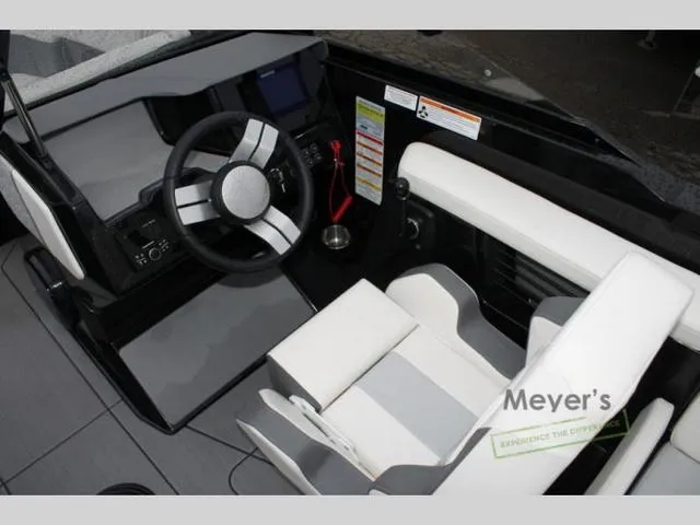 Slide: The Image of 2024 Heyday H20 boat cockpit with modern steering wheel and seating. - 9
