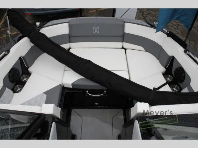 Slide: The Image of 2024 Heyday H20 boat interior with cushioned seating and cup holders. - 8