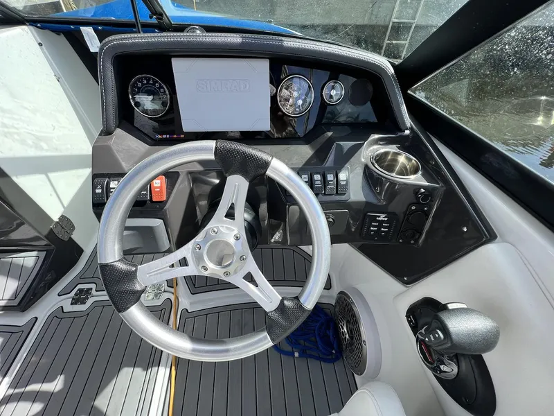 Slide: The Image of Cockpit of 2022 Monterey M-45 boat with steering wheel and control panel. - 10