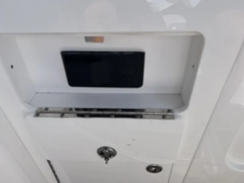 Slide: The Image of 2022 Monterey M-45 boat compartment with lock and storage space. - 14