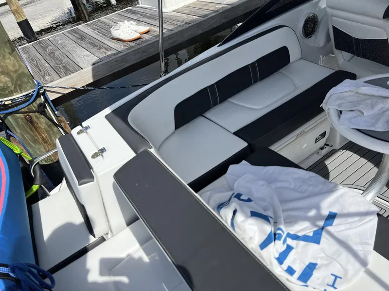 Slide: The Image of Luxury seating area on a 2022 Monterey M-45 boat docked by a pier. - 19