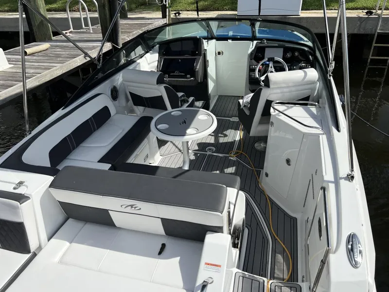 Slide: The Image of 2022 Monterey M-45 boat interior with seating, table, and helm station. - 21