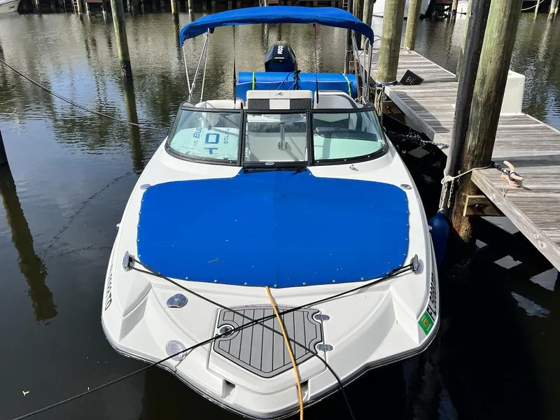 Slide: The Image of 2022 Monterey M-45 boat docked with blue cover and canopy. - 3