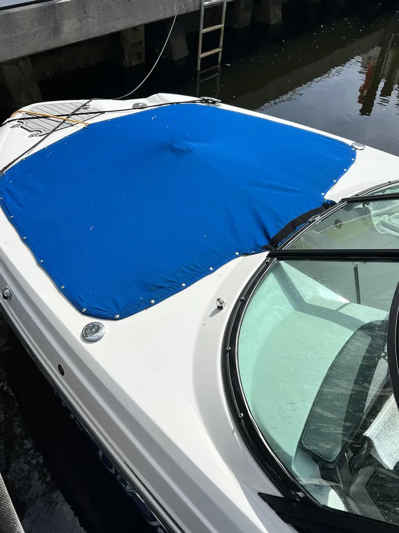 Slide: The Image of 2022 Monterey M-45 boat with blue cover docked at marina. - 5