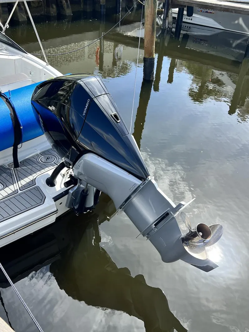 Slide: The Image of 2022 Monterey M-45 boat with an outboard motor docked in a marina. - 6