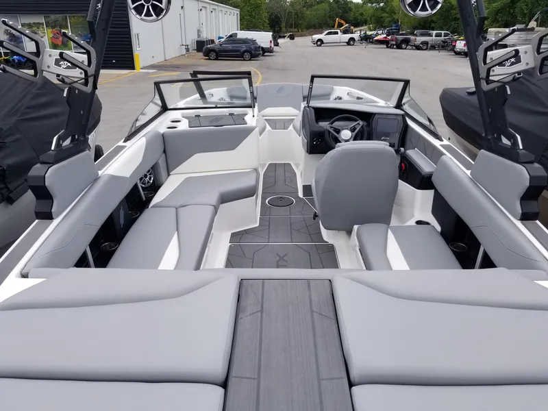Slide: The Image of 2023 ATX Surf Boats 20 Type-S interior with gray seating and modern dashboard. - 10