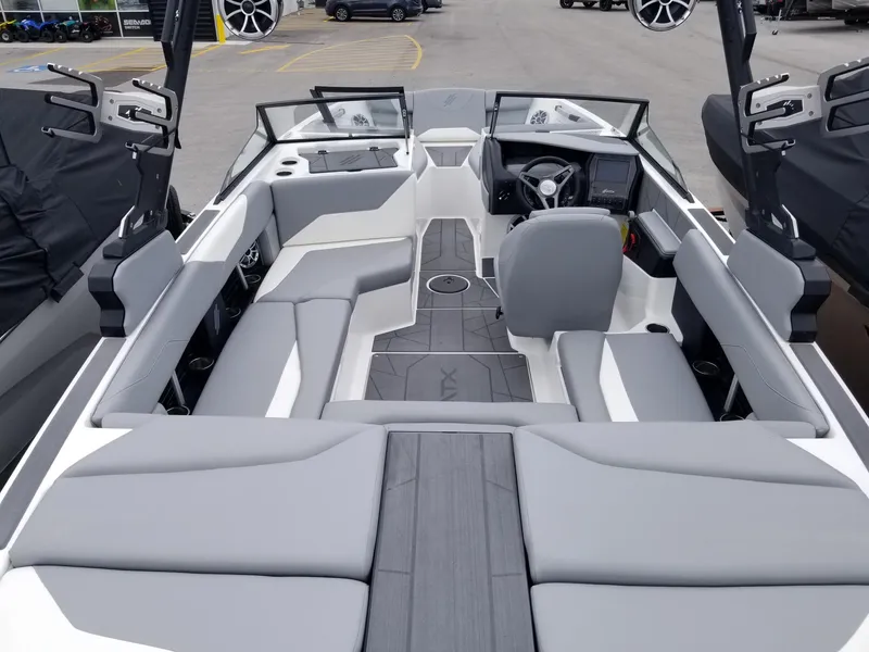 Slide: The Image of 2023 ATX Surf Boats 20 Type-S interior with gray seating and modern dashboard. - 11