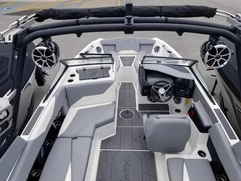Slide: The Image of 2023 ATX Surf Boats 20 Type-S interior with gray seating and advanced dashboard. - 12