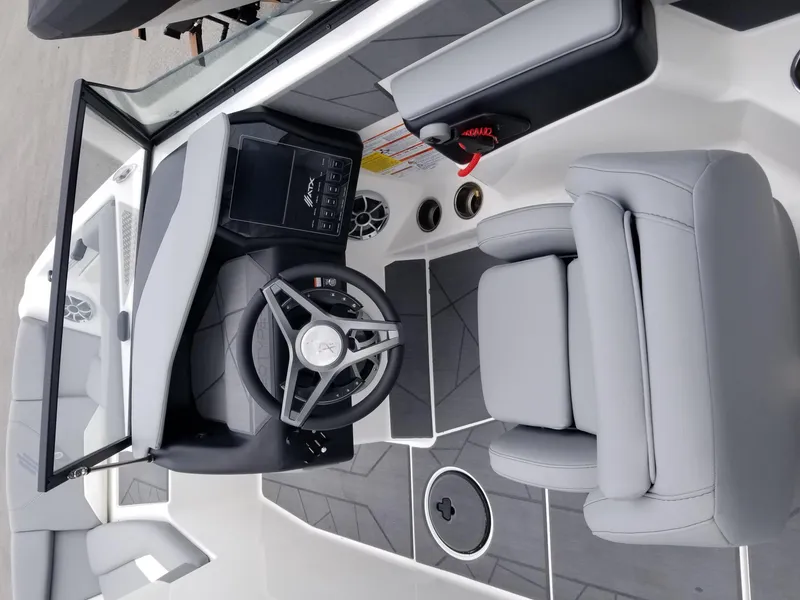 Slide: The Image of 2023 ATX Surf Boats 20 Type-S cockpit with modern steering wheel and comfortable seating. - 14