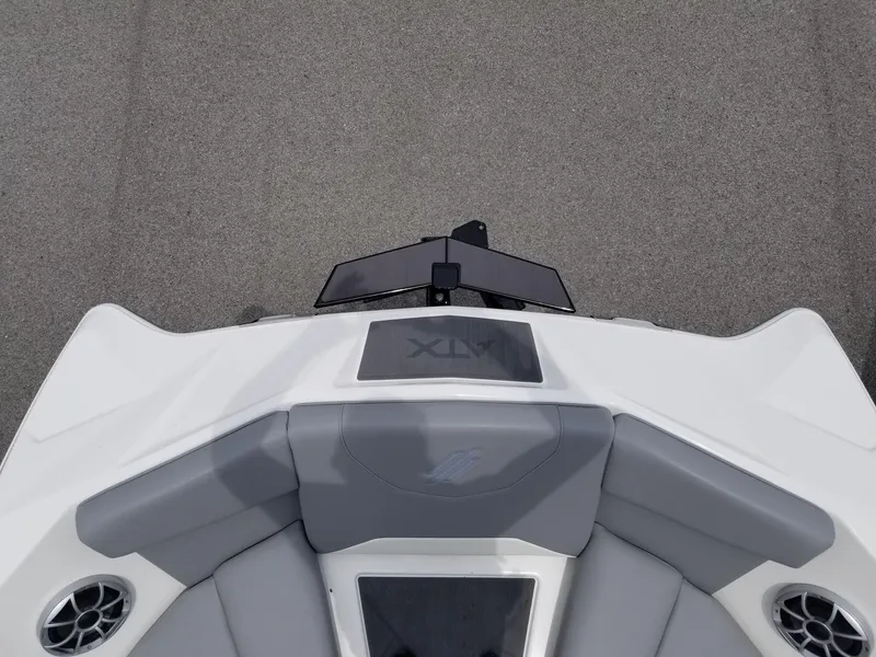 Slide: The Image of 2023 ATX Surf Boats 20 Type-S bow seating area with gray and white upholstery. - 18