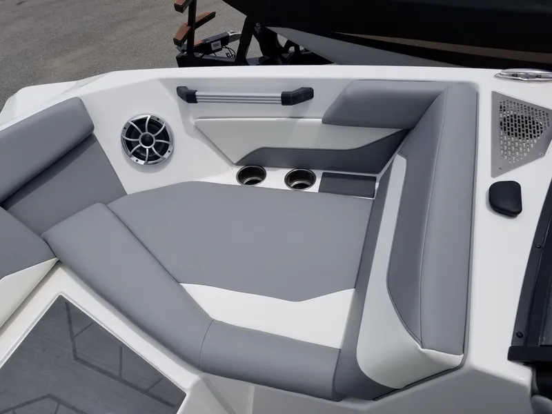 Slide: The Image of 2023 ATX Surf Boats 20 Type-S interior seating with cup holders and speaker. - 20