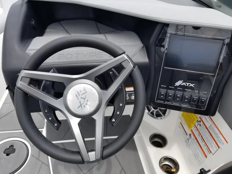 Slide: The Image of 2023 ATX Surf Boats 20 Type-S steering wheel and dashboard. - 22