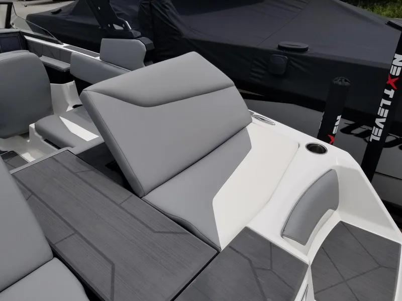 Slide: The Image of 2023 ATX Surf Boats 20 Type-S interior with gray and white seating. - 25