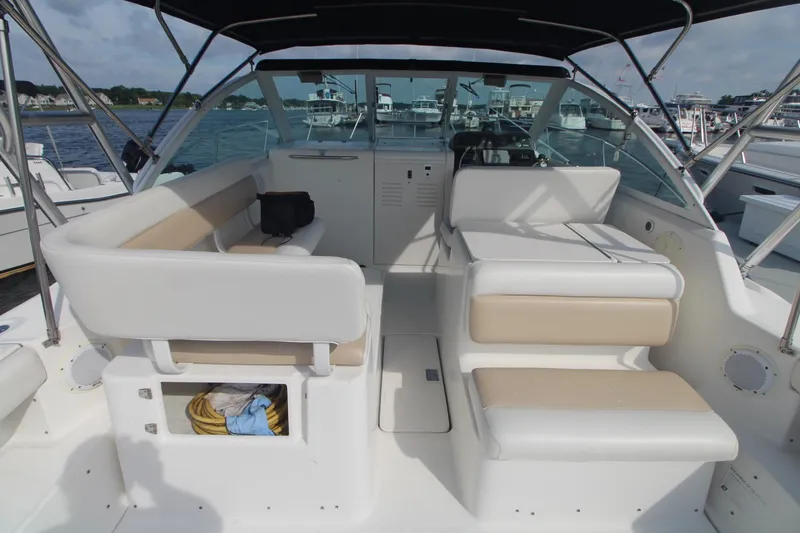 Slide: The Image of 2001 Tiara Yachts 2900 Coronet interior with white seating and open water view. - 11