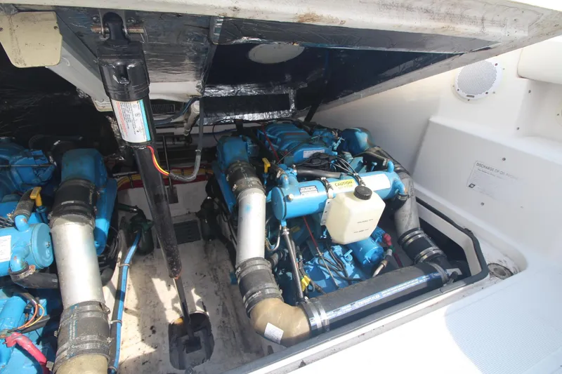 Slide: The Image of Engine compartment of a 2001 Tiara Yachts 2900 Coronet, showcasing dual blue marine engines. - 30