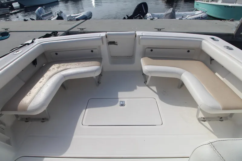 Slide: The Image of 2001 Tiara Yachts 2900 Coronet boat interior with cushioned seating and storage. - 7