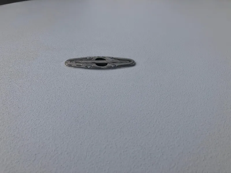 Slide: The Image of Mitzi Skiffs 17, 2025 model, deck cleat detail on textured surface. - 10