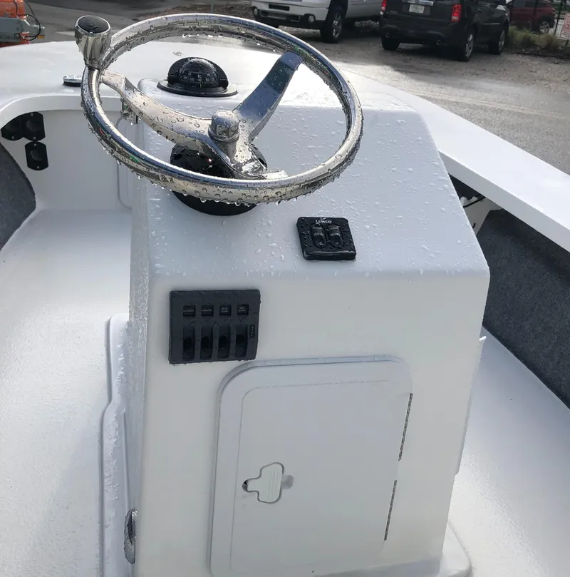 Slide: The Image of 2025 Mitzi Skiffs 17 boat console with steering wheel and controls. - 21