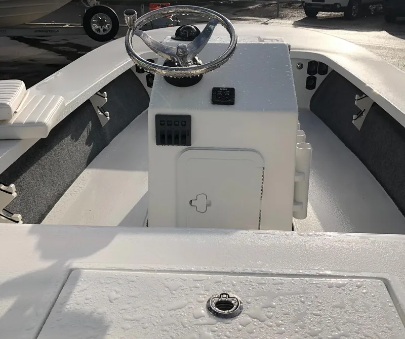 Slide: The Image of 2025 Mitzi Skiffs 17 boat interior with steering console and seating. - 24