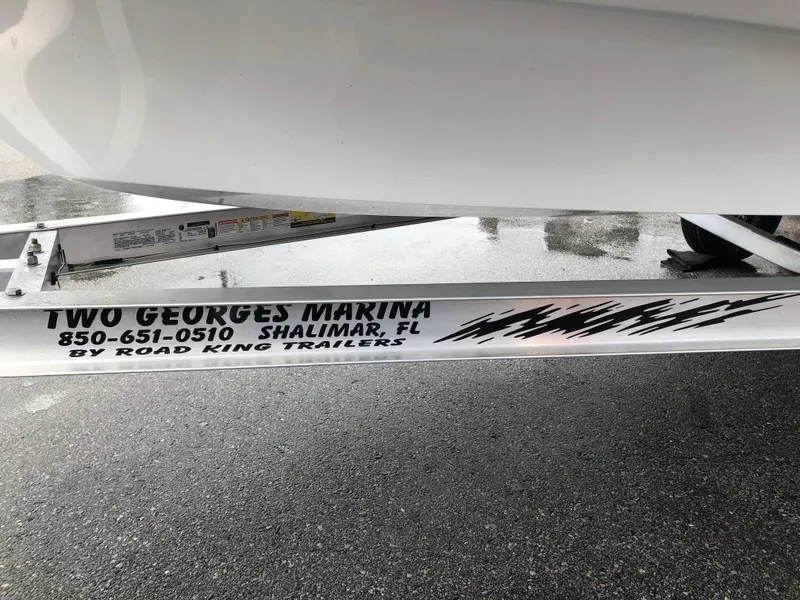 Slide: The Image of Mitzi Skiffs 17 boat trailer at Two Georges Marina, Shalimar, FL, 2025 model. - 6