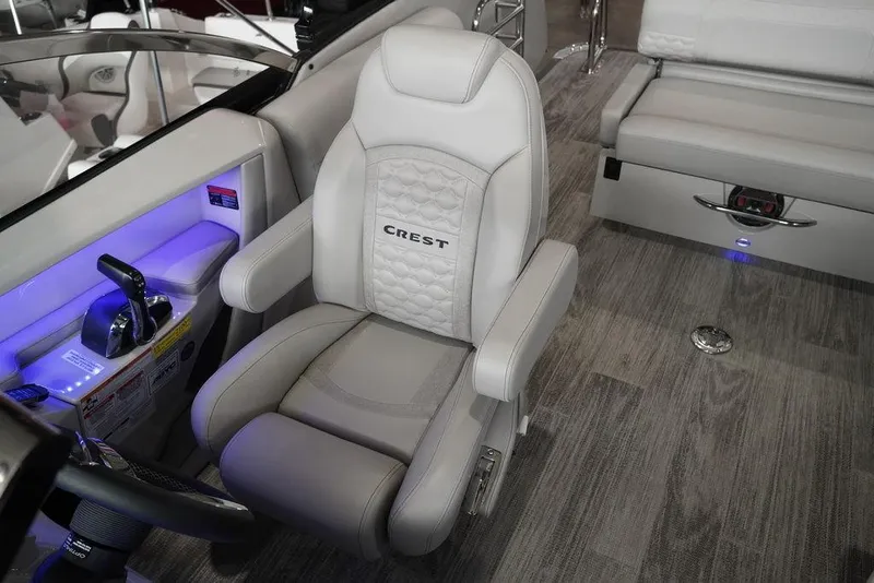 Slide: The Image of 2024 Crest Continental 250 SLS CP3 boat interior with luxurious captain's chair. - 12