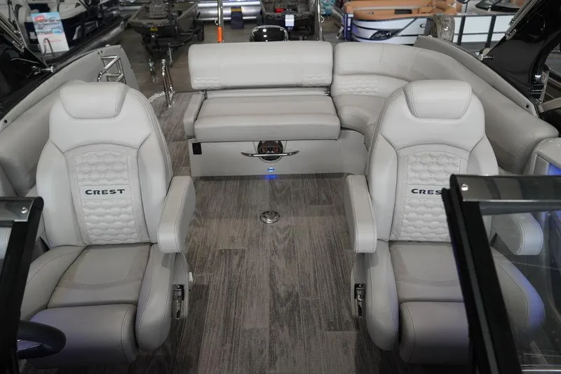 Slide: The Image of 2024 Crest Continental 250 SLS CP3 boat interior with luxurious seating. - 13