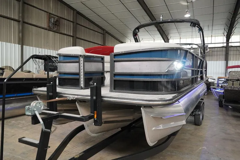 Slide: The Image of 2024 Crest Continental 250 SLS CP3 pontoon boat in a showroom. - 19