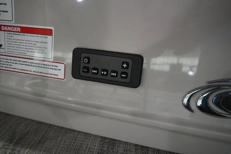Slide: The Image of Control panel of 2024 Crest Continental 250 SLS CP3 boat with warning labels. - 2