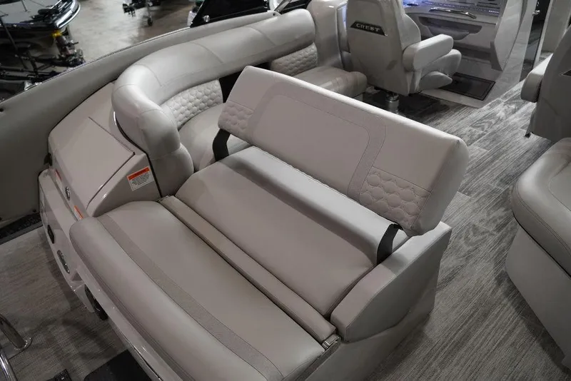 Slide: The Image of 2024 Crest Continental 250 SLS CP3 boat interior with luxurious seating. - 4