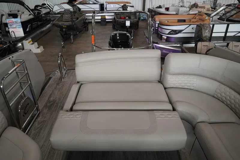Slide: The Image of 2024 Crest Continental 250 SLS CP3 pontoon boat interior with luxurious seating. - 5