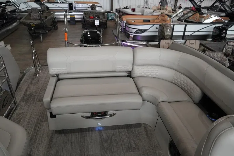 Slide: The Image of 2024 Crest Continental 250 SLS CP3 pontoon boat interior with luxurious seating. - 7