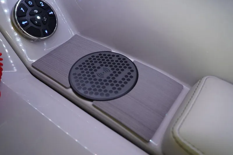 Slide: The Image of 2024 Crest Continental 250 SLS CP3 boat interior with wireless charging pad and control panel. - 8
