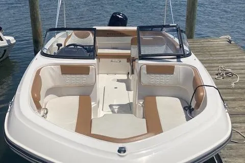Slide: The Image of 2021 Bayliner VR5 boat docked, featuring spacious seating and modern design. - 1