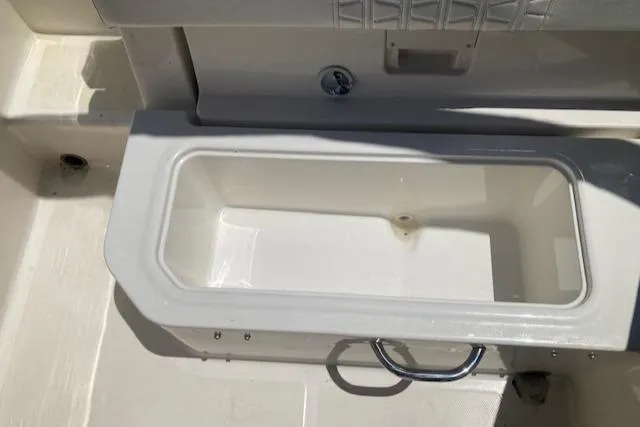 Slide: The Image of Bayliner VR5 2021 boat storage compartment with white interior. - 5