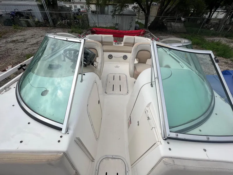 Slide: The Image of 2004 Bryant 234 boat with open bow seating and dual windshields. - 5