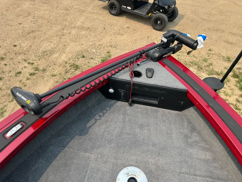 Slide: The Image of 2023 Tracker Targa V-18 WT boat with trolling motor on carpeted deck. - 11