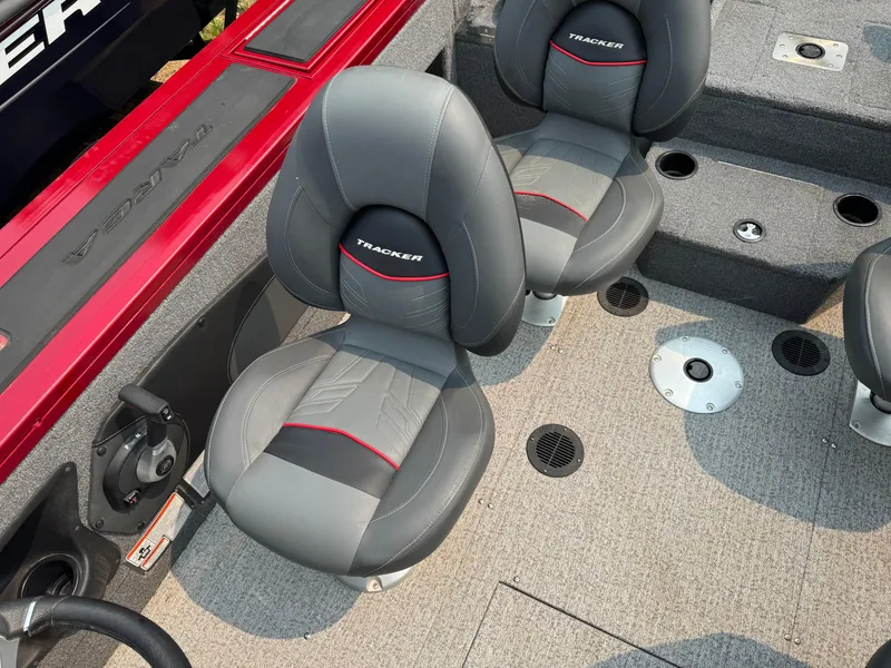 Slide: The Image of 2023 Tracker Targa V-18 WT boat interior with gray and red seating. - 6