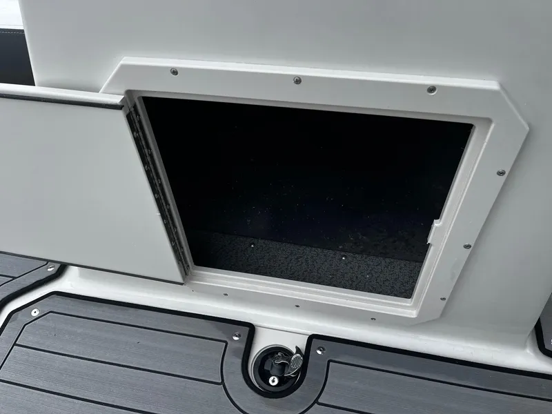 Slide: The Image of 2024 Starcraft SVX 190 boat storage compartment with open hatch. - 11