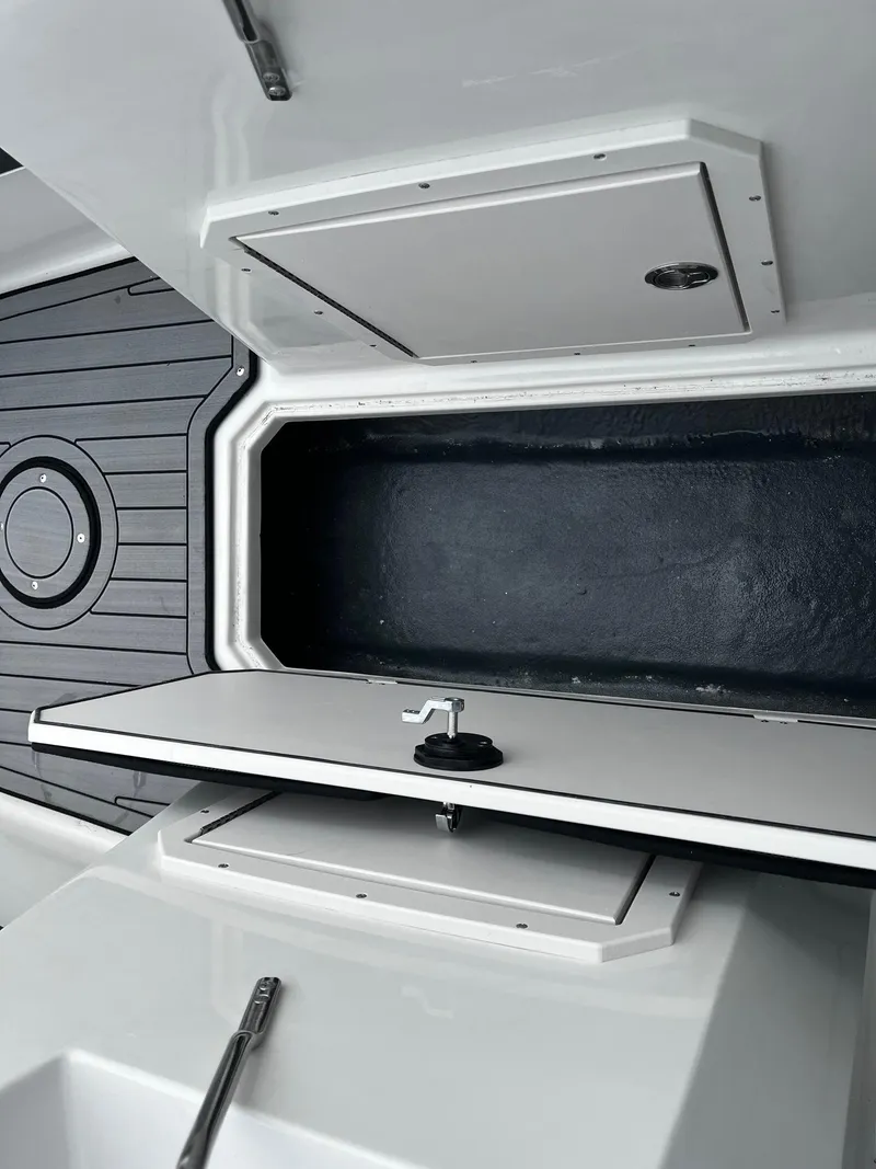 Slide: The Image of 2024 Starcraft SVX 190 boat storage compartment with open hatch. - 13