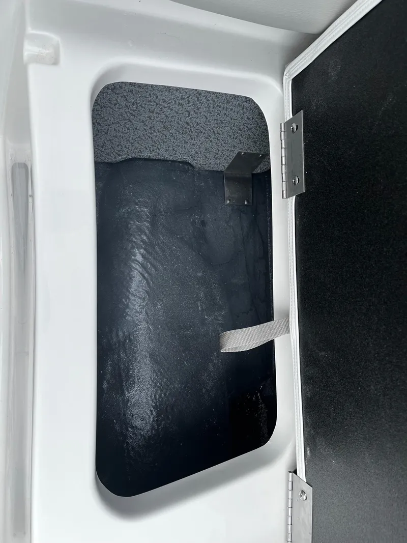 Slide: The Image of Storage compartment of 2024 Starcraft SVX 190 boat with open hatch. - 15