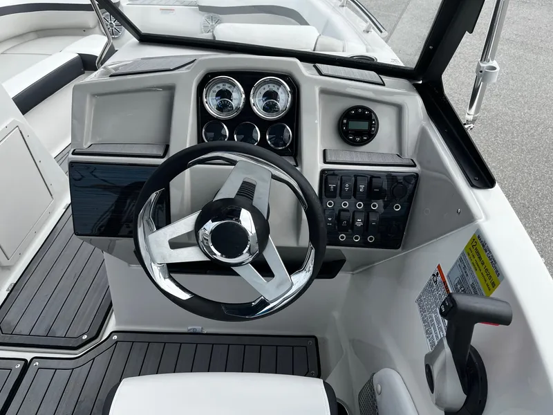 Slide: The Image of 2024 Starcraft SVX 190 boat dashboard with steering wheel and control panel. - 19