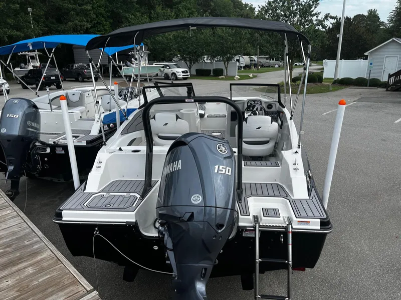 Slide: The Image of 2024 Starcraft SVX 190 boat with Yamaha 150 outboard motor, docked in a marina. - 4