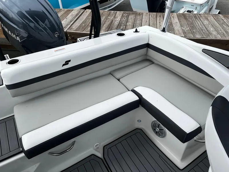 Slide: The Image of 2024 Starcraft SVX 190 boat interior with white and black cushioned seating. - 5